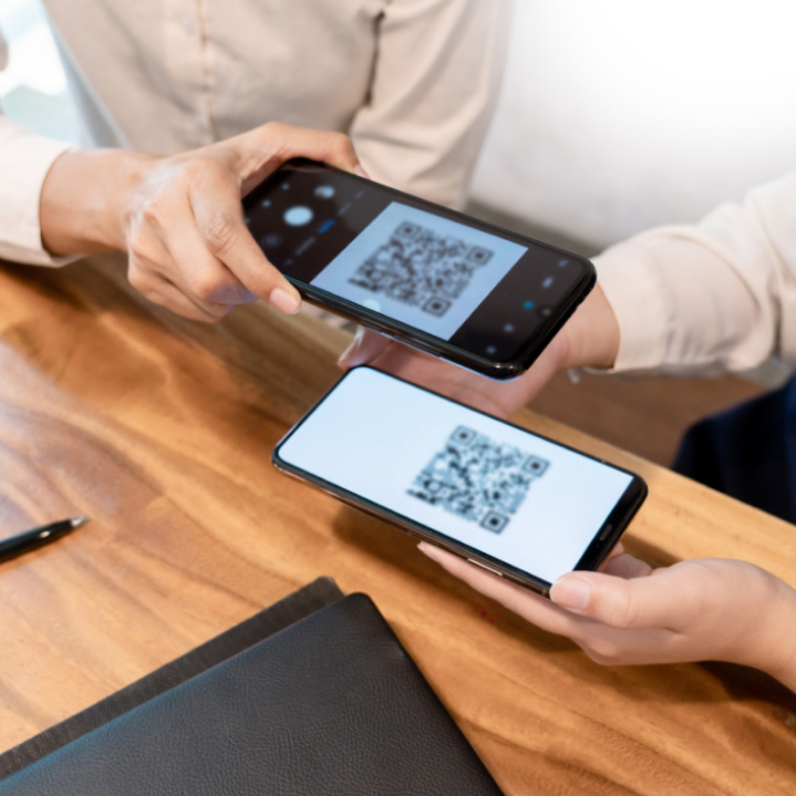 Hands exchanging a business card